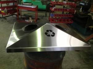 Stainless steel public bin top by Tait Stainless.